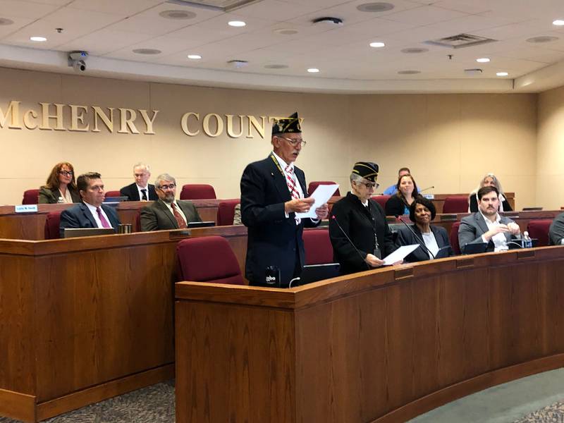 McHenry County Board members Carl Kamienski (R-Johnsburg) and Lou Ness (D- Woodstock) read a Veterans' Day proclamation at an Oct. 17 McHenry County board meeting.