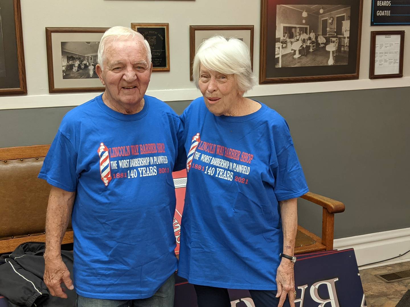 Lincolnway Barbershop owner Don Kinley, left, and his wife Sharon, right, wear shirts that celebrated the shop's 140th anniversary in 2021. The shop closed its doors on Nov. 5, 2025  The shop closed its doors on Nov. 5, 2025 after 144 years of being in business.