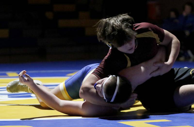 Richmond-Burton’s Shane Falasca tries to pin Johnsburg’s Aiden Bowley in the 215-pound match of a Kishwaukee River Conference wrestling meet on Thursday, Jan. 30, 2025, at Johnsburg High School.