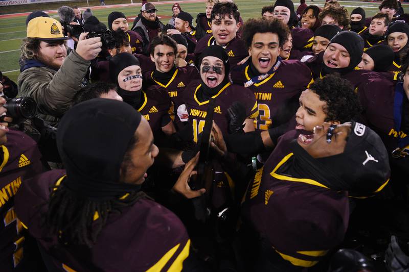 Montini players celebrate their 47-33 victory over Rochester during the IHSA Class 4A state championship game on Friday, Nov. 28, 2025 in Normal.