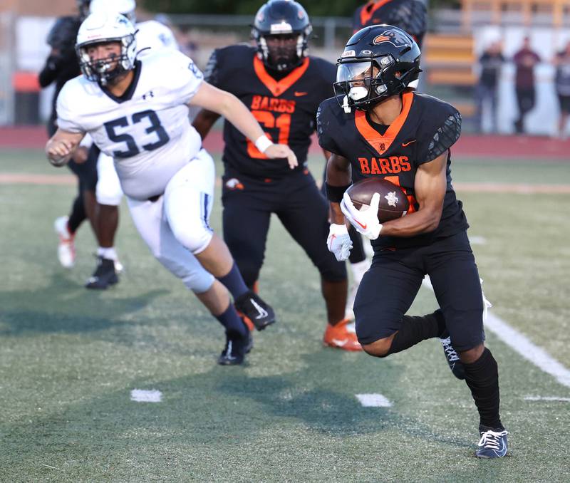 DeKalb's Xavier Dandridge gets outside of the Plainfield South defense for a nice gain during their game Friday, Sept. 1, 2023, at DeKalb High School.