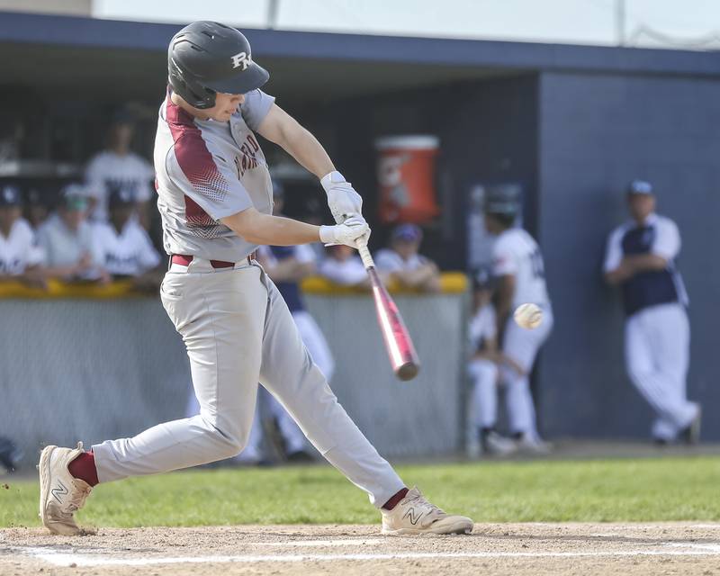 Plainfield North's Chase Holtzman (21) swings at a pitch during baseball game between Plainfield North at Oswego East, Monday, April 28, 2025 in Oswego.