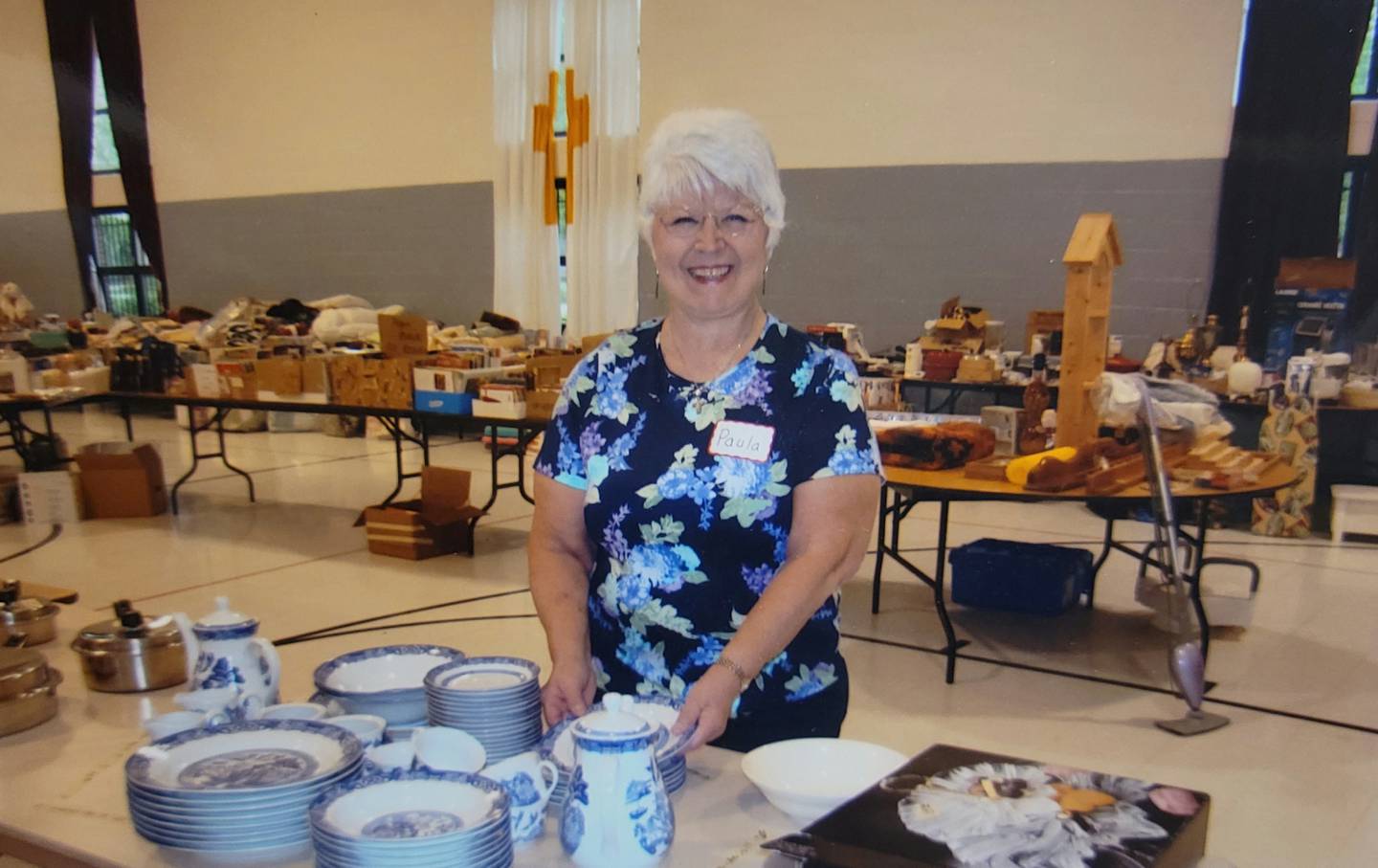 Paula Forester of Mokena lived her faith in words and deeds. She is shown volunteering at a garage sale in 2014 at St. John's United Church of Christ in Mokena.