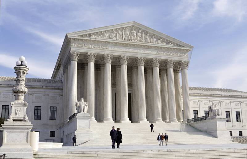 FILE - This photo shows the U.S. Supreme Court Building, Wednesday, Jan. 25, 2012 in Washington. A draft opinion circulated among Supreme Court justices suggests that a majority of high court has thrown support behind overturning the 1973 case Roe v. Wade that legalized abortion nationwide, according to a report published Monday night, May 2, 2022 in Politico. (AP Photo/J. Scott Applewhite, File)