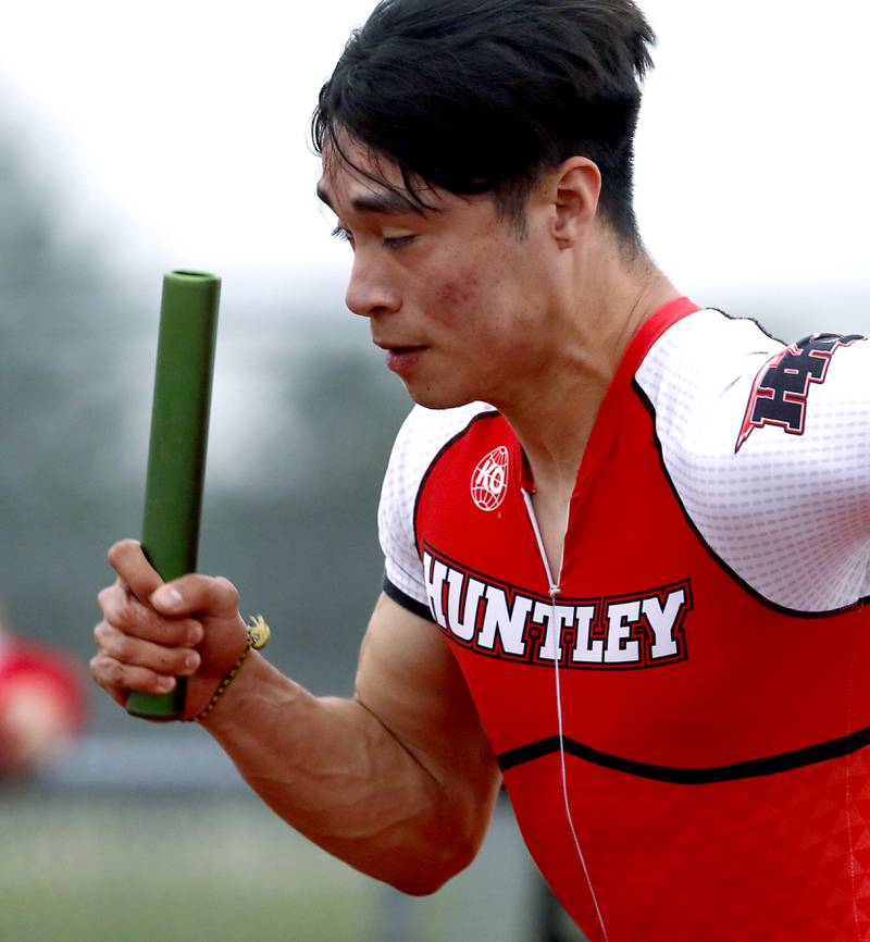 Huntley’s Brandon Torres fires out of the blocks as he runs the first leg of the 4 x 100 meter relay during the IHSA Class 3A Huntley Boys Track and Field Sectional Wednesday, May 18, 2022, at Huntley High School.