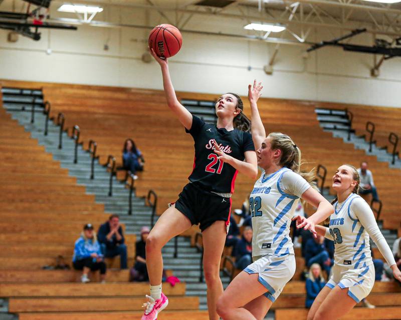St Charles East's Sofia O’sullivan (21) puts up a layup at the York Thanksgiving Tournament. Nov 13, 2023.