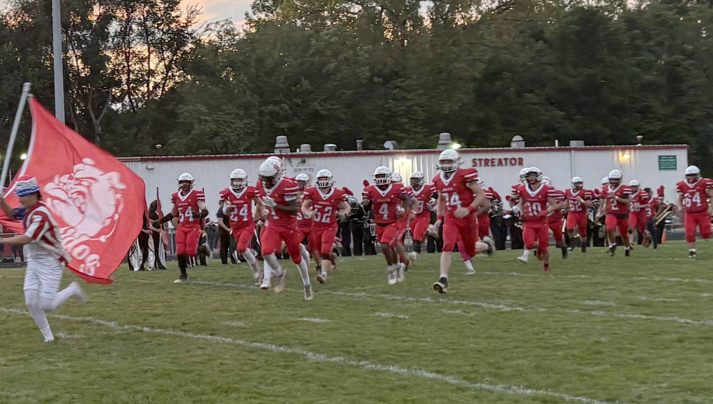 Members of the Streator football team run onto the field as they play Coal City on Friday, Sept. 19, 2025 at Doug Dieken Stadium.
