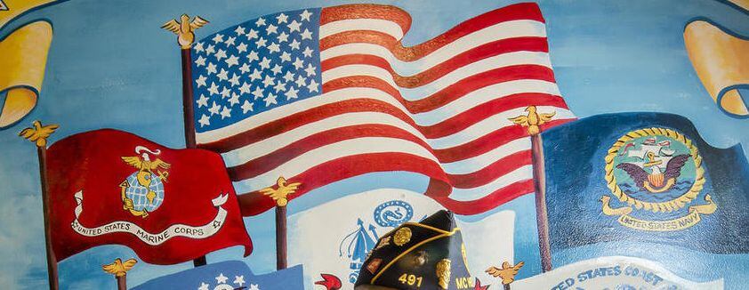 A mural that hung at the McHenry American Legion Hall, shown in 2017, honors the branches of the military.