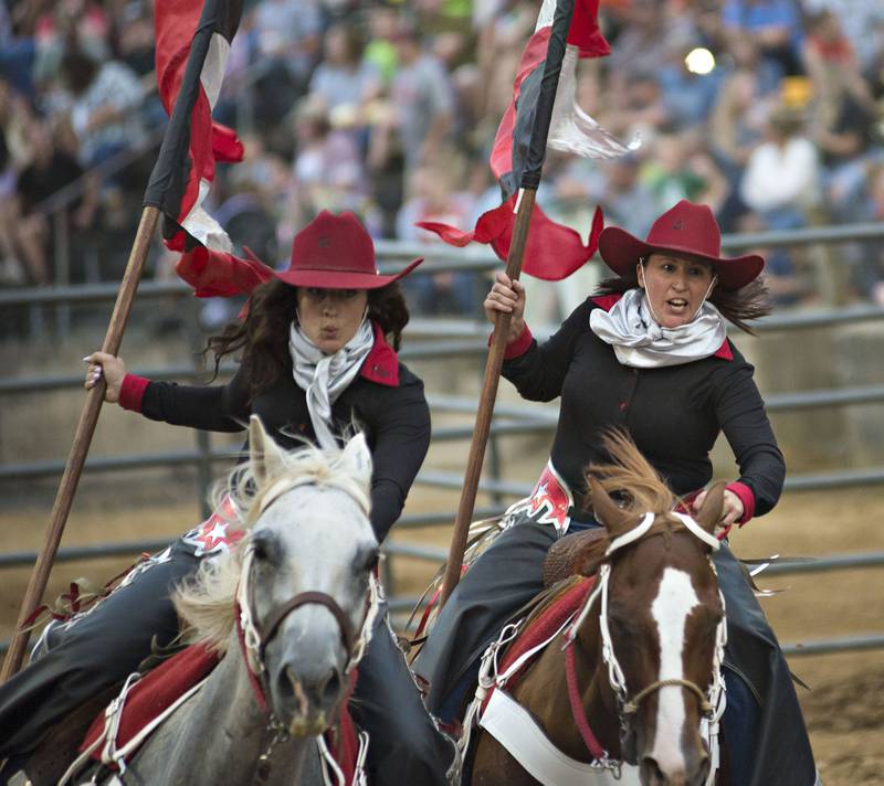 The Stateline Hotshots rodeo drill team perform for the crowd Thursday, August 5, 2021 at the Carroll County Fair in Milledgeville. The riders were part of the Rice Bull Riding rodeo.