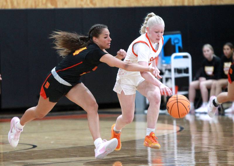 Batavia’s Hallie Crane (left) and St. Charles East’s Addie Schilb (right) go after the ball during a game on Wednesday, Jan. 8, 2025 in St. Charles.