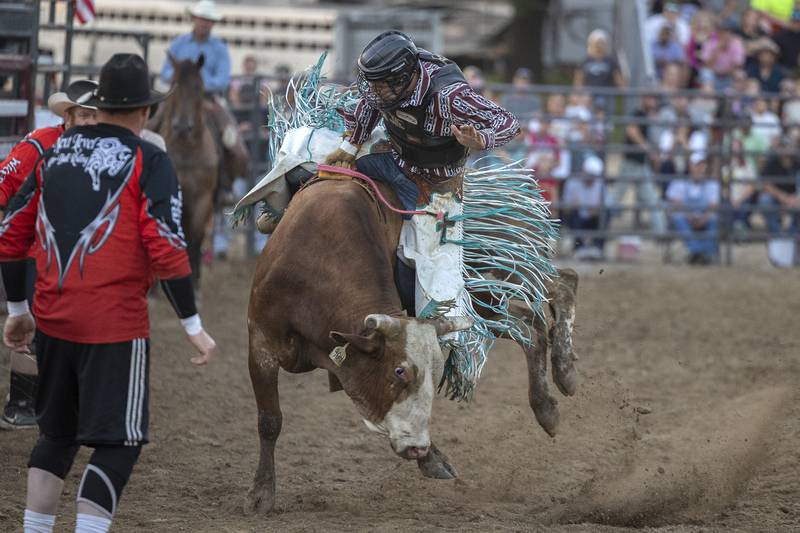 Nick Prater holds on tight Tuesday, August 15, 2023 in the Next Level Pro Bull Riding event at the Whiteside County Fair.