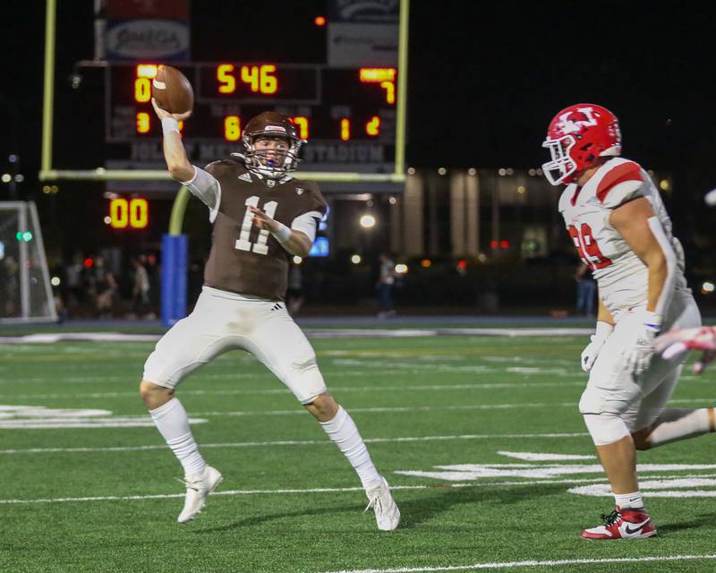 Joliet Catholic's Lucas Simulick (11) passes during a football game between Marist at Joliet Catholic on Friday, Sept 20th, 2024  in Joliet.