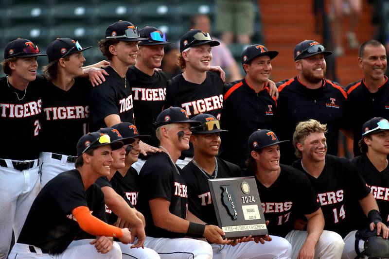 Crystal Lake Central players celebrate a win in supersectional baseball action against DePaul College Prep at Wintrust Field in Schaumburg Monday.