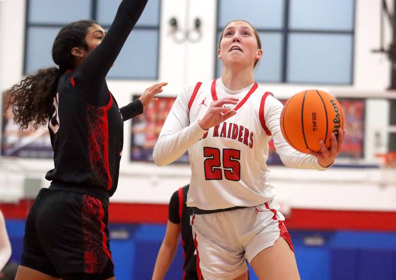 Huntley’s Evelyn Freundt heads for the hoop against Mundelein in varsity girls basketball Komaromy Classic tournament  action on Tuesday, Dec. 30, 2025, at Dundee-Crown High School in Carpentersville.