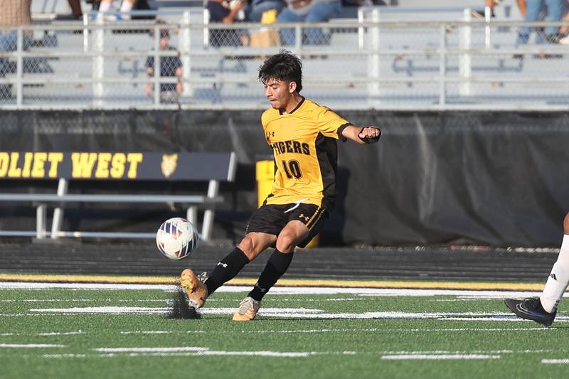 Joliet West’s Javier Contreras makes a pass against Joliet Central on Tuesday, Oct. 3, 2023 in Joliet.