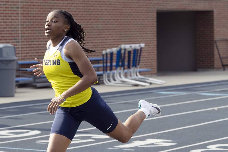 Ta’ah Liberty crosses the finish line in the 100 dash Wednesday, May 14, 2025, during Sectionals at Sterling High School.