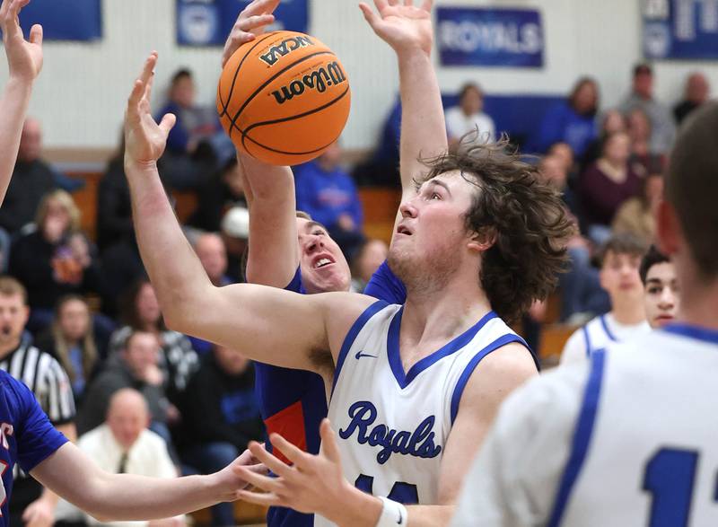 Hinckley-Big Rock's Martin Ledbetter and Genoa-Kingston's Nathan Kleba go after a rebound during their game Tuesday, Jan. 7, 2025, at Hinckley-Big Rock High School.