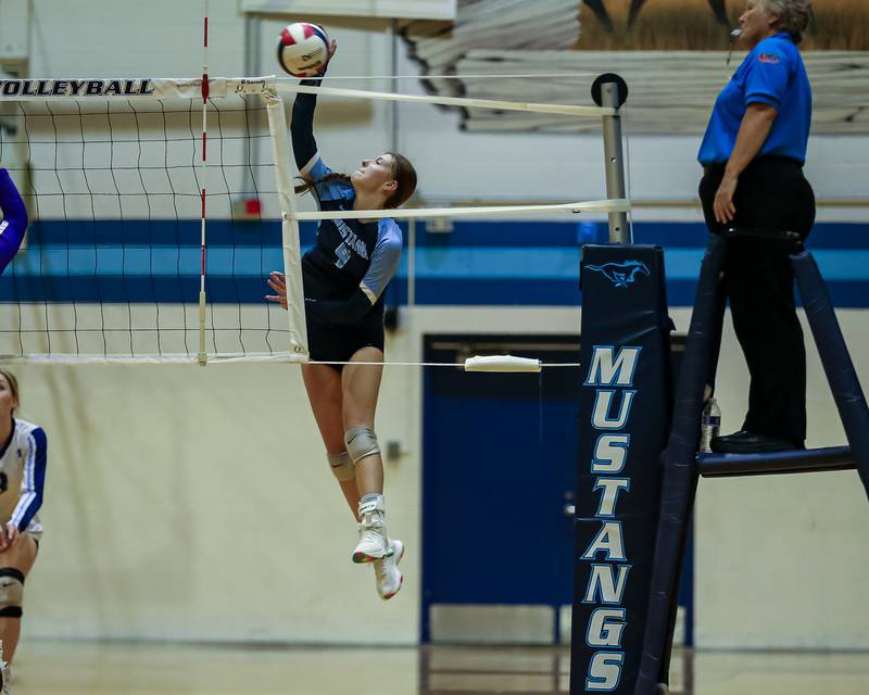 Downers Grove South's Sylvia Masiulionis (4) with a kill shot during volleyball match between Downers Grove North at Downers Grove South.  Sept 7, 2023.
