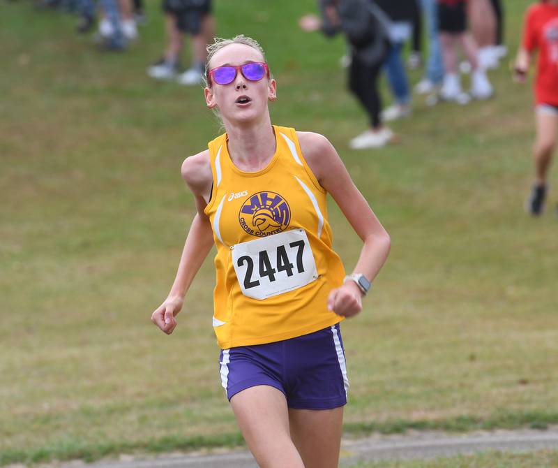 Mendota's Lumen Setchell heads to the finish line at the Amboy Columbus Day Cross Country Invitational at Shady Oaks Country Club near Amboy on Monday, Oct. 13, 2025.