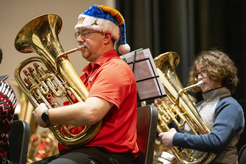 Brandon Czubachowski plays his instrument as part of the TubaChristmas performance on December 15, 2024 at Hall High School.
