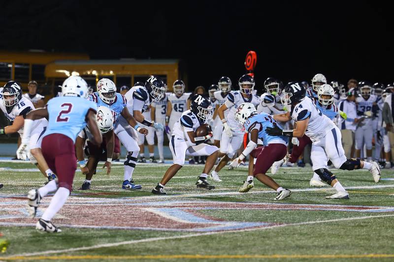 Nazareth's Charles Calhoun pivots to evade a Kankakee defender during Kankakee's 33-12 loss to Nazareth on Friday, Aug. 29, 2025.