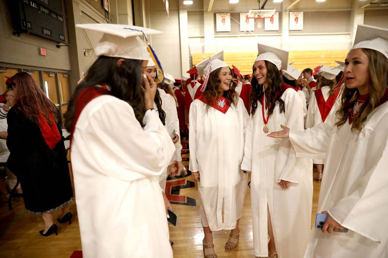 Benet graduates gather in the gymnasium before the school’s commencement ceremony in Lisle on Thursday, May 25, 2023.