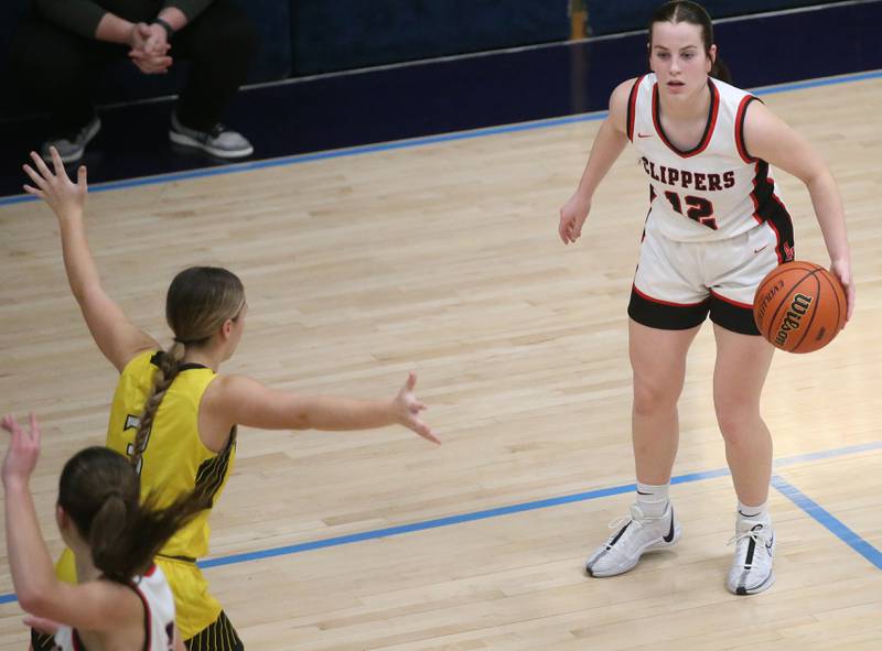 Amboy's Addison Pertell looks to pass the ball around Putnam County's Gabby Doyle during the Class 1A Regional semifinal game on Monday, Feb. 12, 2024 at Marquette High School.