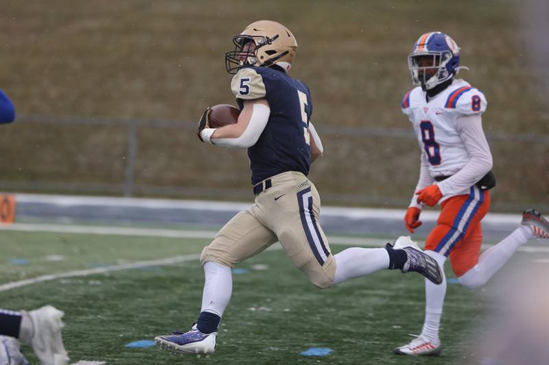 Lemont’s Nate Wrublik rushes for a touchdown early in the first quarter against East St. Louis in the Class 6A semifinal in Lemont on Saturday.