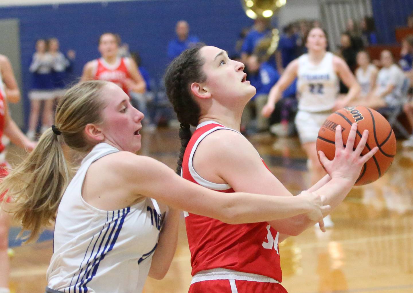 Ottawa's Mary Stisser runs in for a layup as Princeton's Paige Jesse draws a foul on Monday, Feb. 5, 2024 in Prouty Gym.
