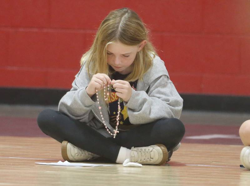 Student Nola Osalla pray the Rosary during the One Million Children Praying the Rosary campaign on Tuesday, Oct. 7, 2025 at Academy of St. Carlo Acutis Oglesby campus.