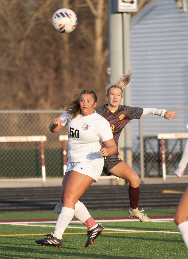 Prairie Ridge's Grace Wolf, left, and Richmond-Burton's Layne Frericks compete for the ball during their game on Wednesday, April 5, 2023 at Richmond-Burton High School in Richmond. Ryan Rayburn for Shaw Local