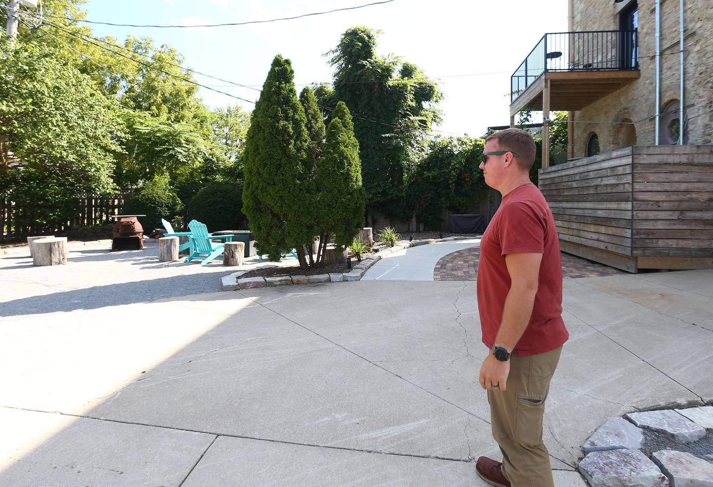 Dan Stash observes the space behind the Bickerman building on Wednesday, Aug. 24, 2022 in Utica.