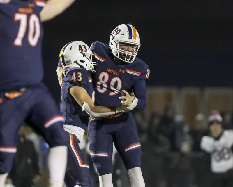 Oswego's Kaleb Stumpenhorst (89) celebrates his field goal with Ethan Pilip (43) which turned out to be the game winning kick during Class 8A semifinal football game between Lockport at Oswego. Saturday, Nov 22, 2025 in Oswego.