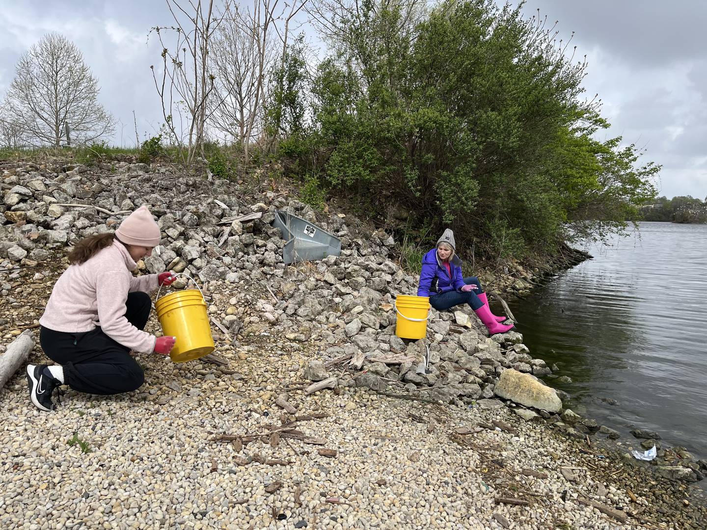Volunteers help clean up plastic trash and other litter on Saturday at the Rock Run Rookery Preserve in Joliet. The cleanup was hosted by the Forest Preserve District of Will County in recognition of Earth Day.