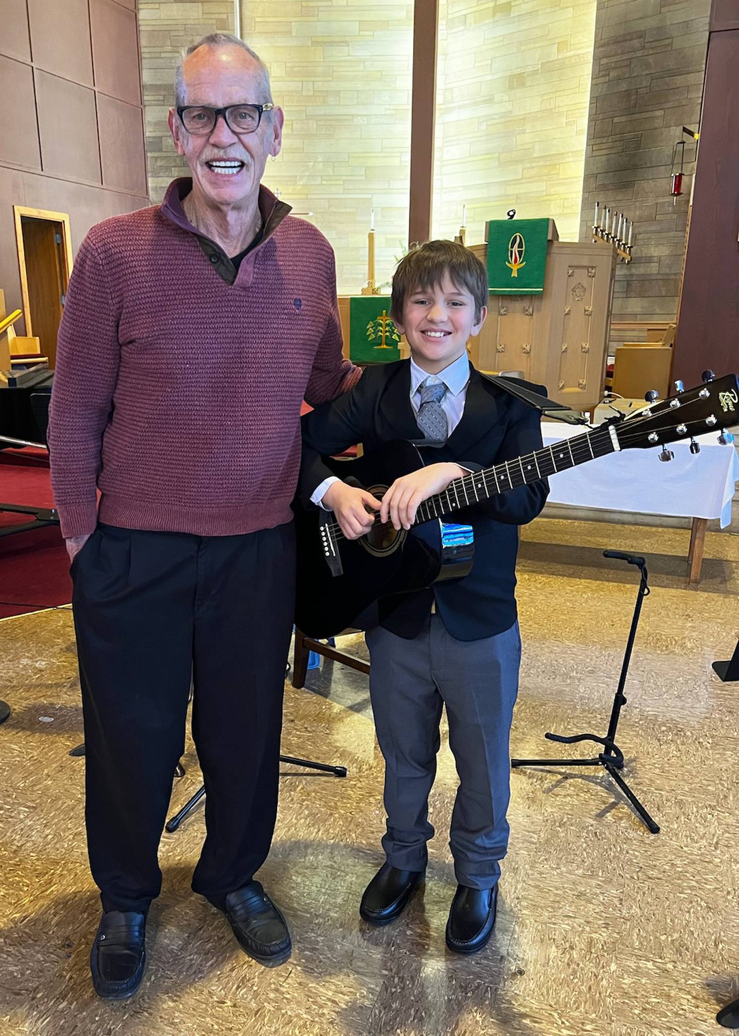 Tucker Crandall (right) poses with Woodlawn Arts Academy guitar instructor James Miller after the Academy’s winter music recital at St. Paul Lutheran Church, Sterling.