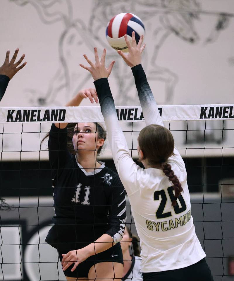 Kaneland's Natalie Remsen tries to tip the ball over Sycamore's Ava Wente-Argo during their match Tuesday, Sept. 30, 2025, at Kaneland High School in Maple Park.