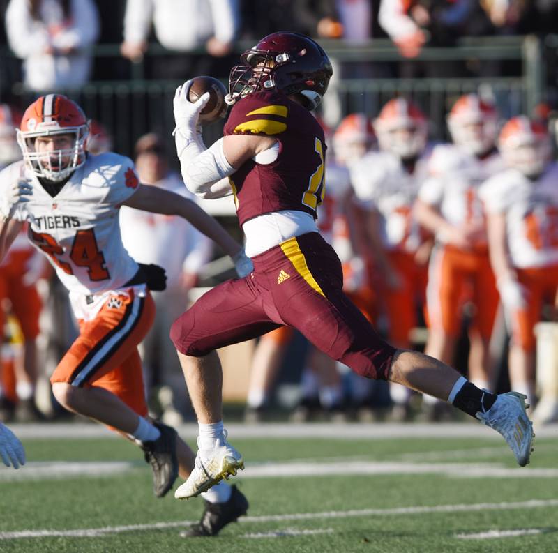 Joe Lewnard/jlewnard@dailyherald.com
Montini's George Asay catches a pass during the Class 3A semifinal game against Byron Saturday.