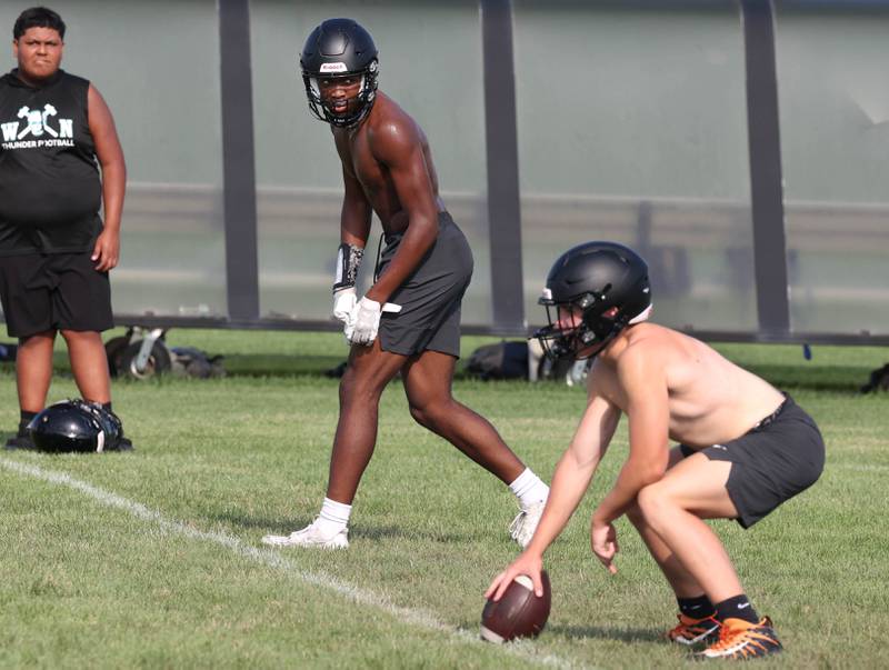 DeKalb’s Davon Grant (left) lines up for a play Tuesday, July 16, 2024, during their matchup with Woodstock North in the Kaneland 7-on-7 at the school in Maple Park.