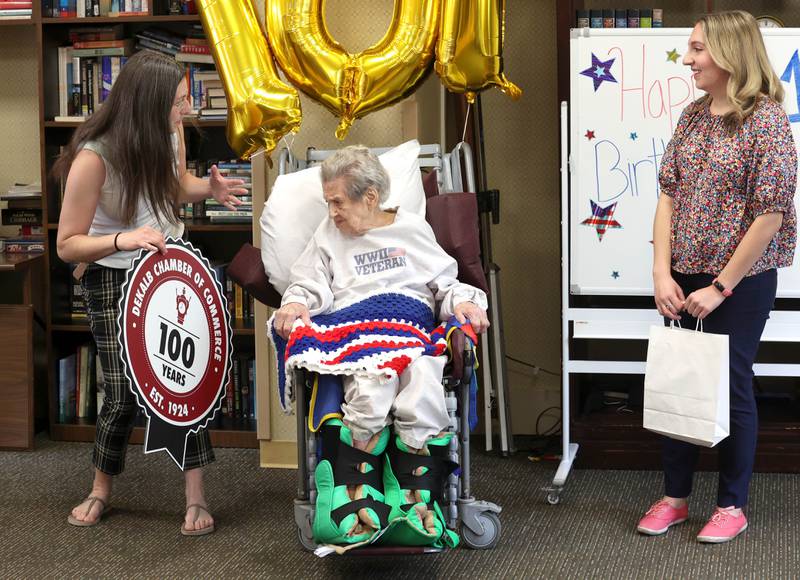 World War II veteran Myrtle Annetta Lusiak  is presented with a gift Thursday, May 2, 2024, from the DeKalb Chamber of Commerce during her birthday celebration at Aperion Care in DeKalb. Lusiak, who turned 107-years-old, was honored by DeKalb officials, veterans and other local groups Thursday for her service in the Women’s Army Corps from Aug. 5, 1943 until her honorable discharge on Nov. 27, 1945.