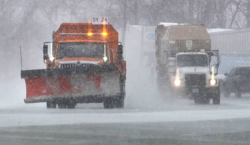 A snowplow lays down salt Thursday, Dec. 22, 2022, on Peace Road in DeKalb. Snow, frigid temperatures and wind rolled into the area Thursday making travel a challenge.