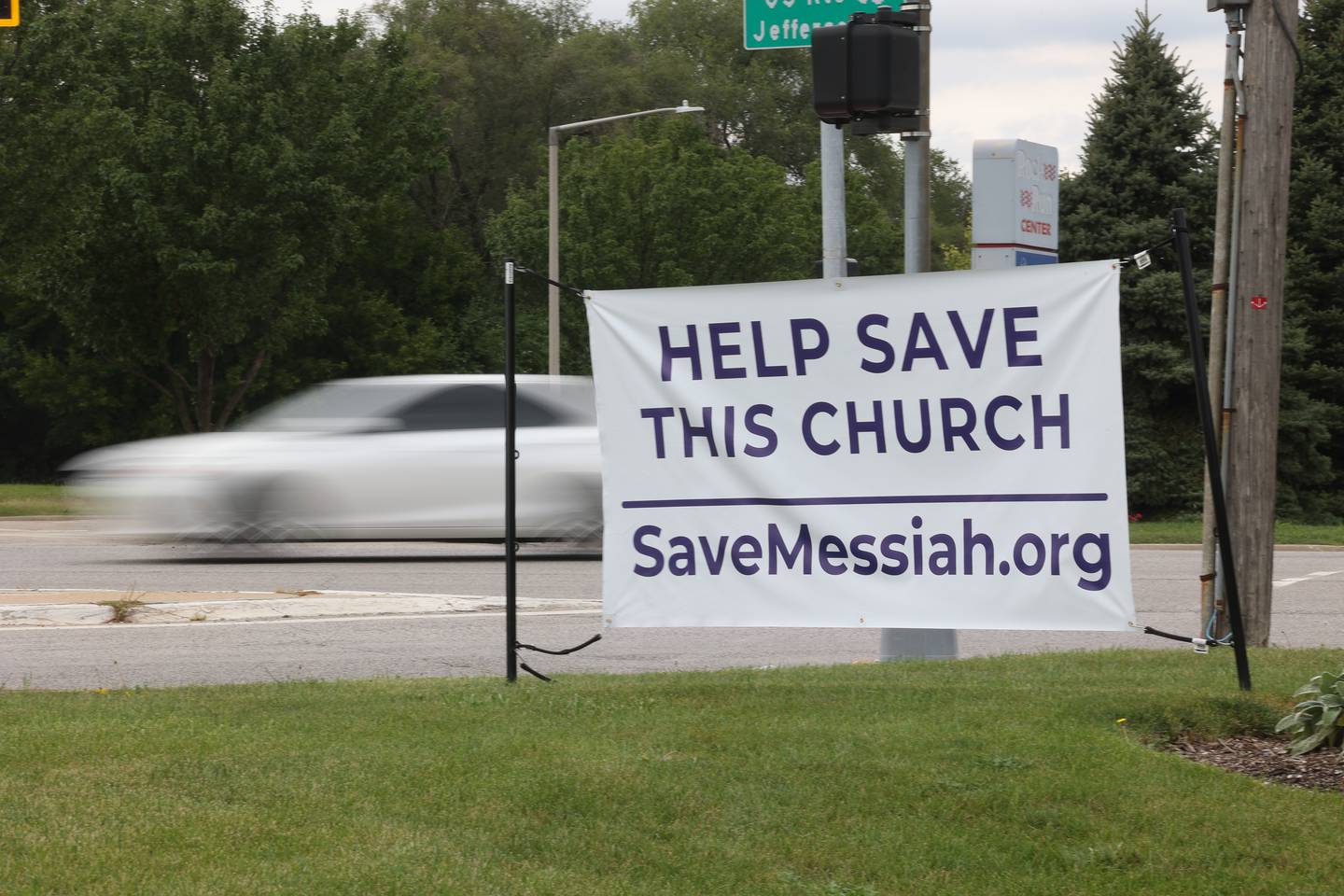 A sign to save Messiah Lutheran sits on the corner of Houbolt Road and Jefferson Street on Thursday, Sept. 7, 2023 at the church in Joliet. As a result of a lawsuit by the Security and Exchange Commission for fraudulent financial dealings by a local company, Messiah Lutheran is required to pay back $487,000 of the $780,000 that was donated over a 10-year period to the church by this local business.