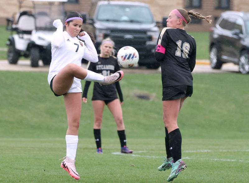 La Salle-Peru's Alicia Martin kicks the ball away from Sycamore's Taylor Zemanek during their game Wednesday, April 9, 2025, at Sycamore High School.