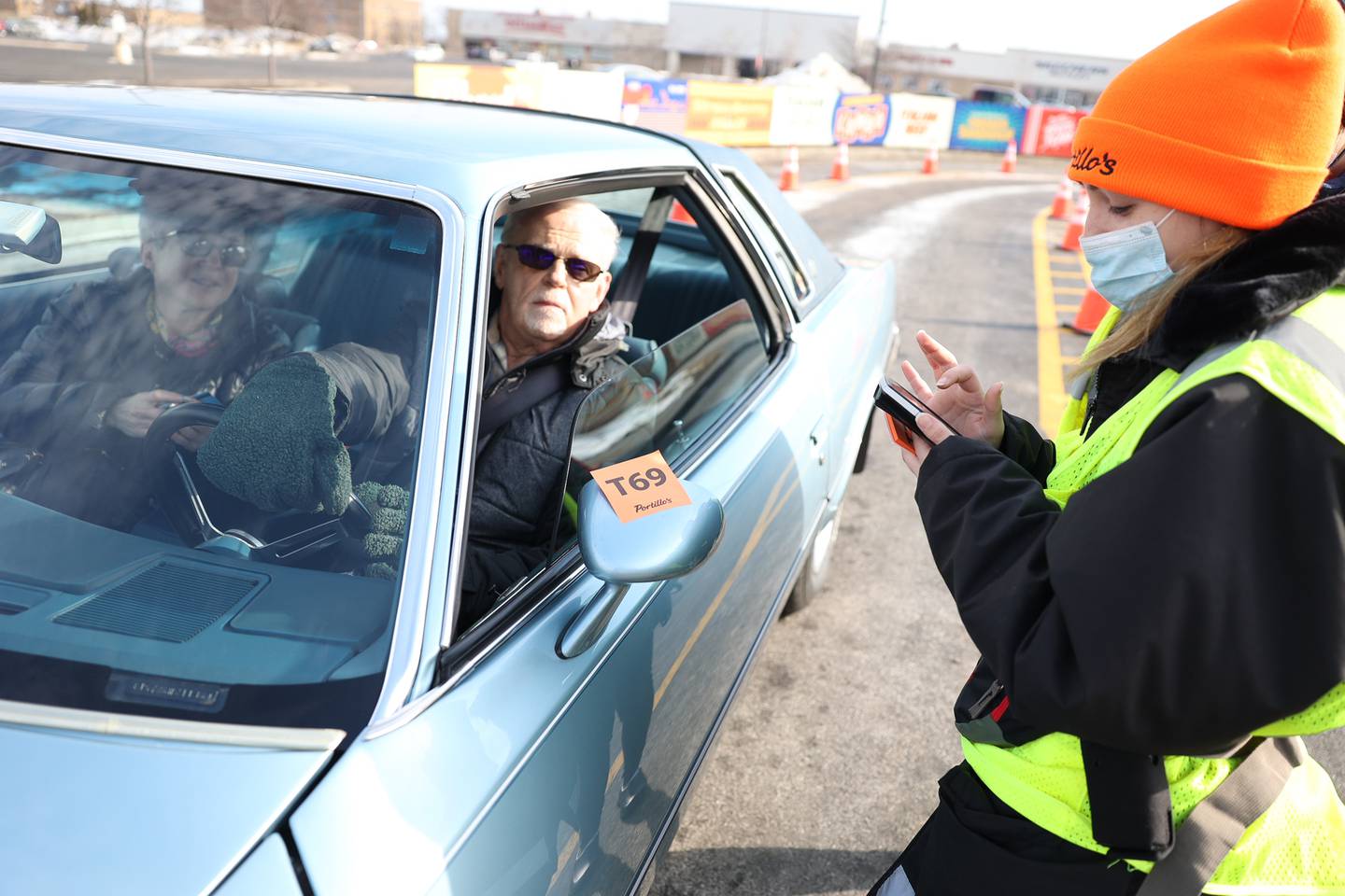 Ed and Debbie Galvan give their order in the drive-through for the open of the new Joliet Portillo’s location on North Larkin. Tuesday, Feb. 1, 2022 in Joliet.
