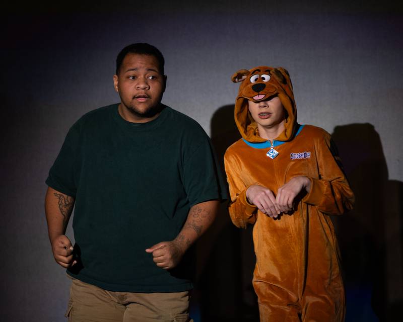'Shaggy' (portrayed by Fredrick Davis) and 'Scooby' (portrayed by Holly Malmassari) hide from 'ghost' during performance of "New Year, New Friends" on Saturday, December 27, 2025 at Stage 212 in LaSalle.