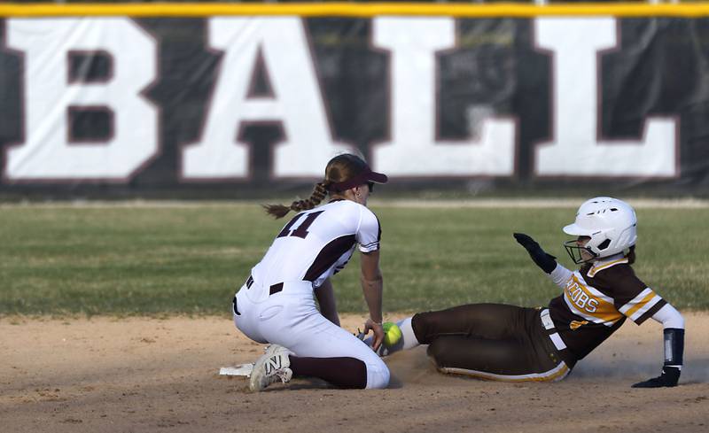 Jacobs' Emily Popilek (right) slides into second base as Prairie Ridge’s Kylie Carroll tries to tag her during a Fox Valley Conference game on April 8, 2026, at Prairie Ridge High School.
