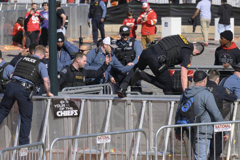 Law enforcement personnel clear the area around Union Station following a shooting at the Kansas City Chiefs NFL football Super Bowl celebration in Kansas City, Mo., Wednesday, Feb. 14, 2024. Multiple people were injured, a fire official said.