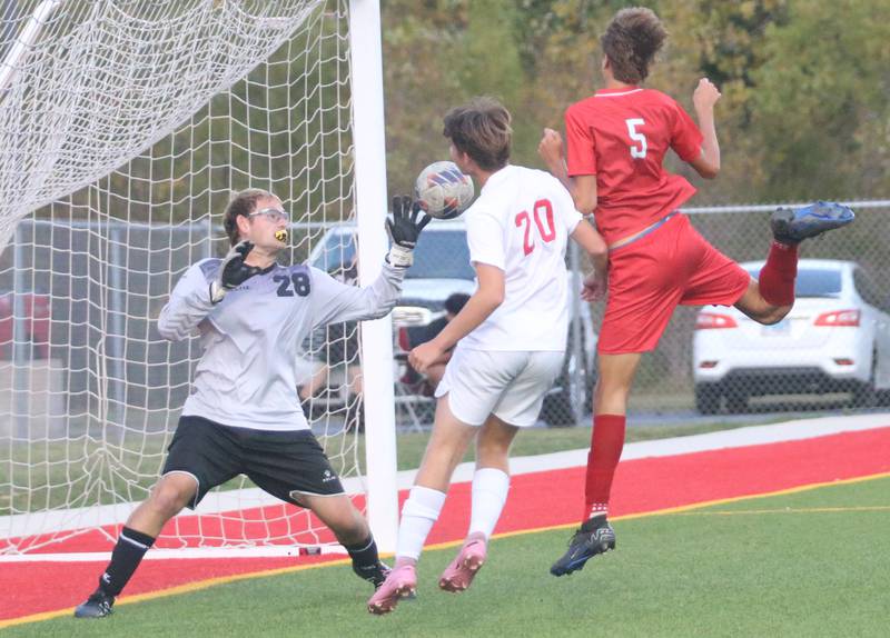 Ottawa keeper Landry Brenbarger blocks a kick from L-P's Parker Abens as Ottawa teammate Yahir Rangel-Soto helps on Monday, Oct. 6, 2025 at the L-P Athletic Complex in La Salle.