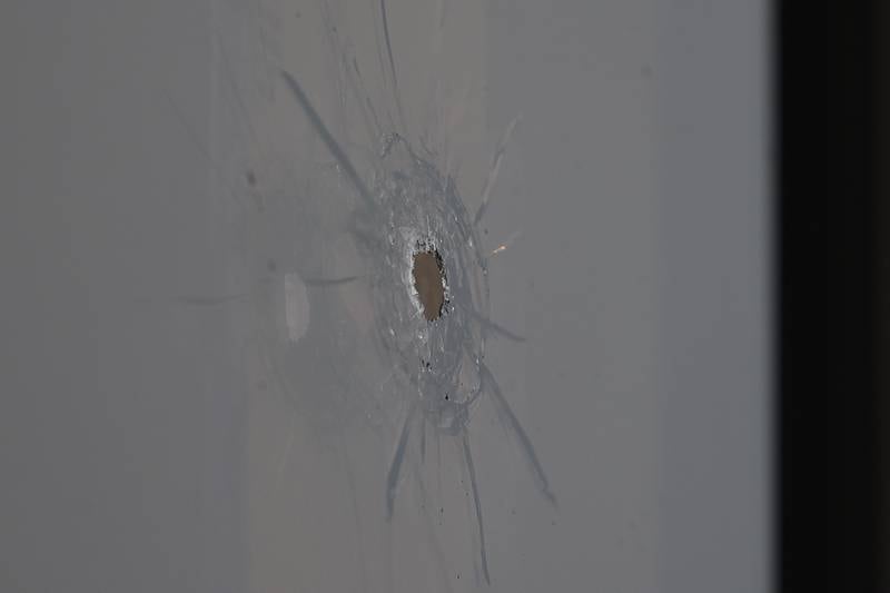 A bullet hole is visible in the window of Merichka’s on Wednesday, April 3, 2024 in Joliet.