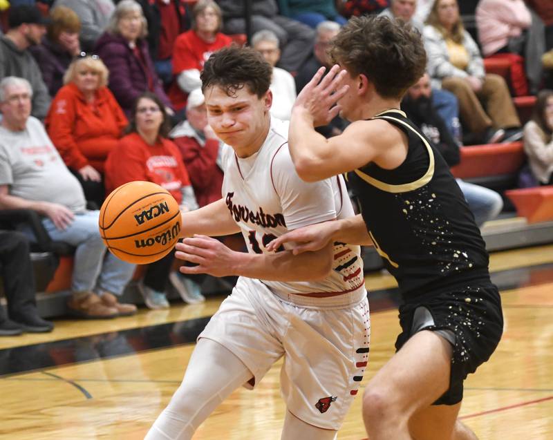 Forreston's Kendall Erdmann drives past a Pecatonica defender on Wednesday, Feb. 11, 2026 at Forreston High School.