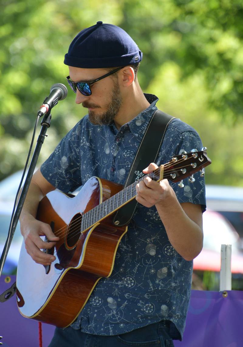 Kevin Kramer provides music Saturday, May 27, 2023, during Sidewalk Chalkapalooza at Soldiers and Sailors Park in Princeton.